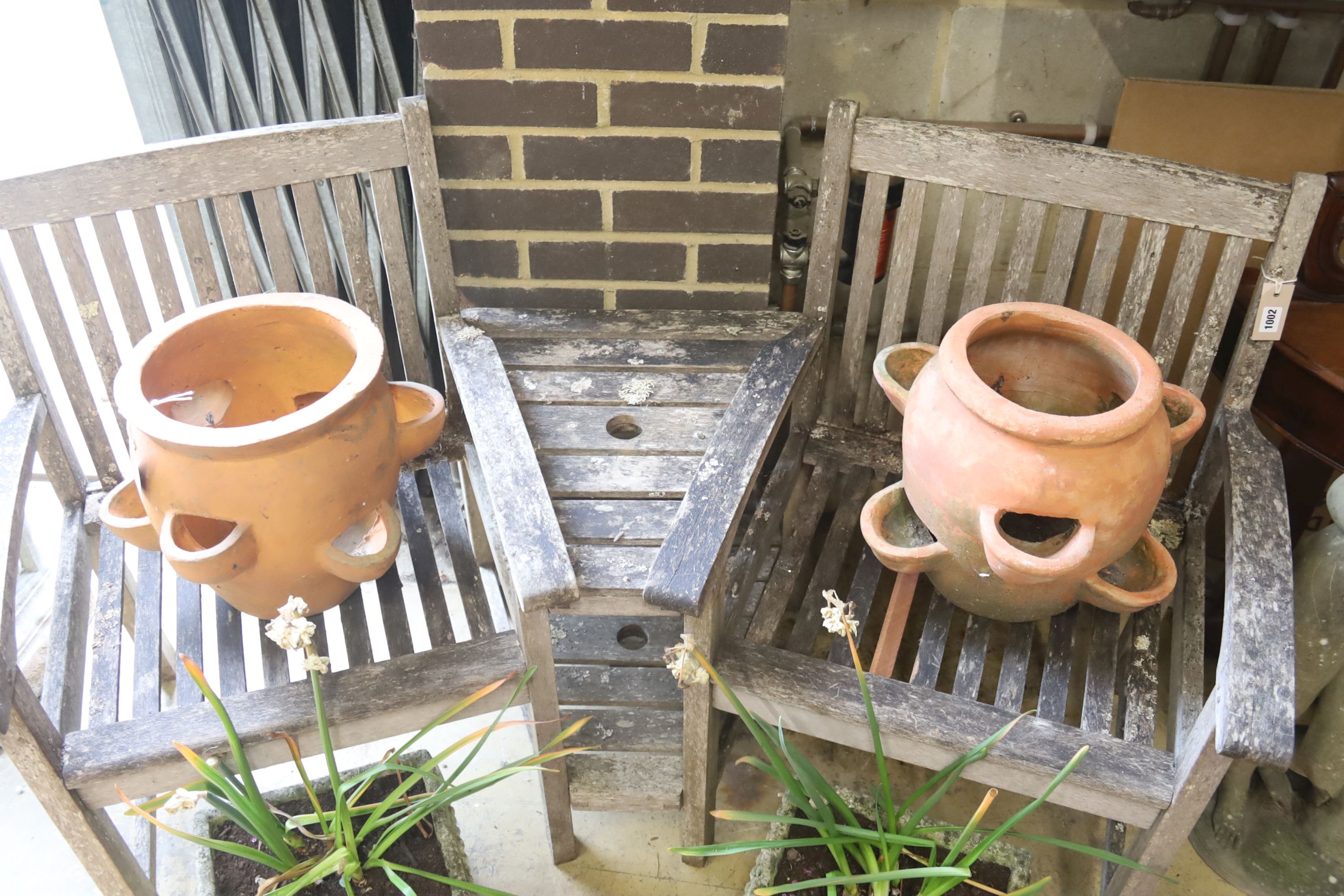 A pair of terracotta garden planters, 40cm diameter, height 32cm